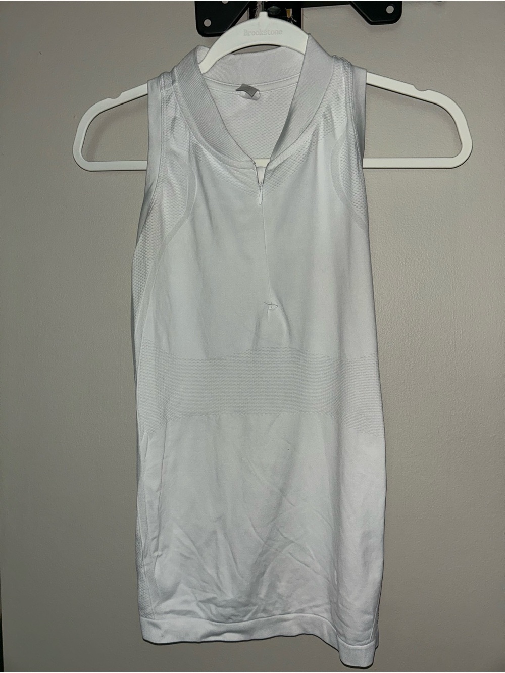 Womenβs White Sleeveless Golf Tee with Zip Neck